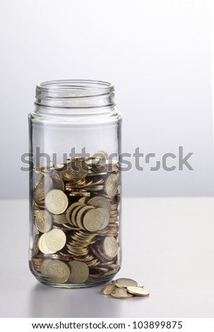 Change in a jar on the white background