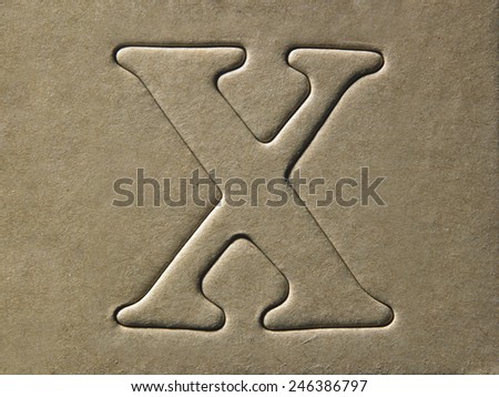 die cut alphabet x on the brown card board