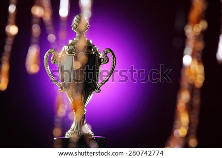 golden trophy on the purple background