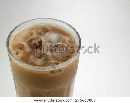 Top view milk tea with ice cube or teh tarik with ice