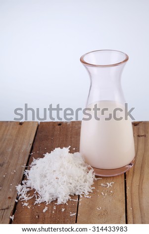 jar of coconut milk and shredded coconut