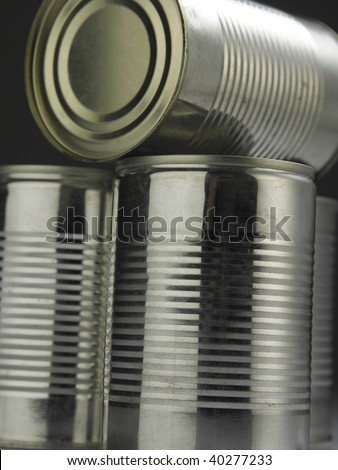 few aluminum cans with reflection