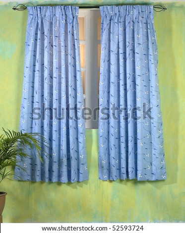 Studio shot of sheer curtains over window.