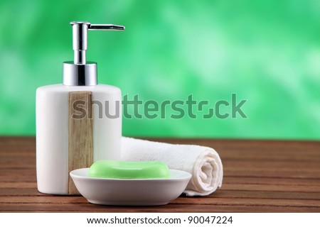 soap and dispenser on the brown table top