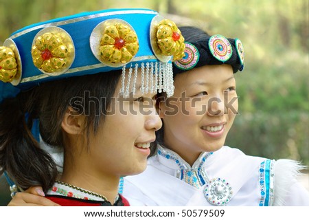 Pretty Chinese girl in the traditional clothes of the Naxi minority culture