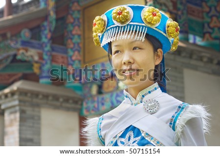Pretty Chinese girl in the traditional clothes of the Naxi cultural minority