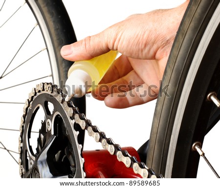 Similar – Image, Stock Photo Technician oiling bike chain in workshop