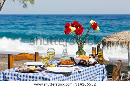 Beautiful romantic table on the beach near the sea