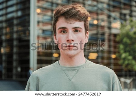 Similar – Image, Stock Photo Serious young stylish guy standing near shabby wall on street