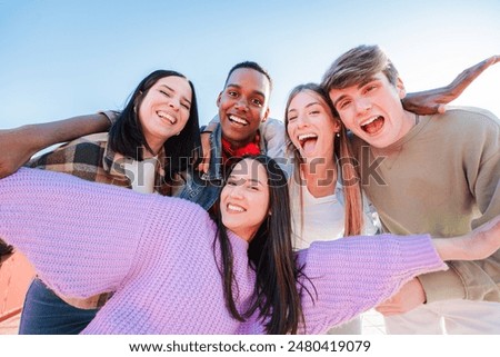 Similar – Image, Stock Photo Group of cheerful teenagers dancing on street