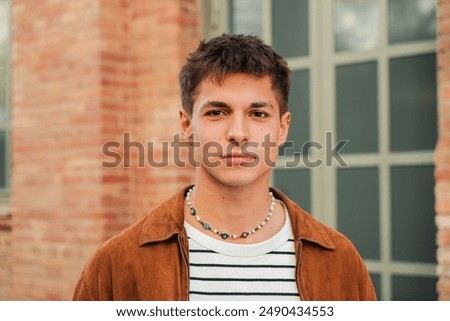 Image, Stock Photo Portrait Of A Serious Young Man Standing On Blue Background