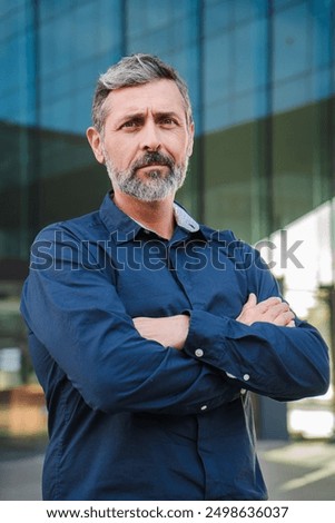 Similar – Foto Bild Geschäftsmann mittleren Alters mit Bart und Brille beim Kaffee im Büro