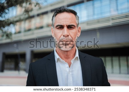 Similar – Image, Stock Photo Determined ethnic male entrepreneur walking on street