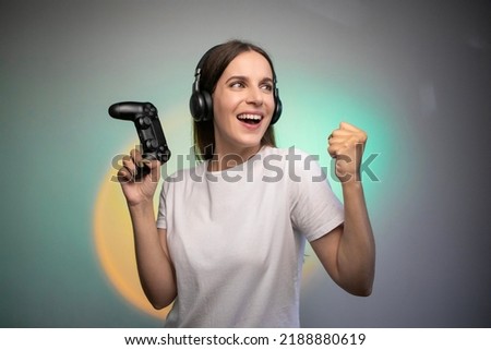 Image, Stock Photo Cheerful women playing videogame on couch