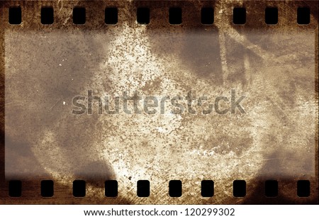 Grunge film strip frame on old paper sheet