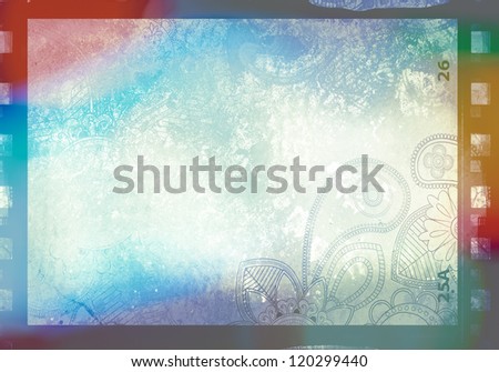Grained film strip abstract grunge texture with paisley ornament and light effect
