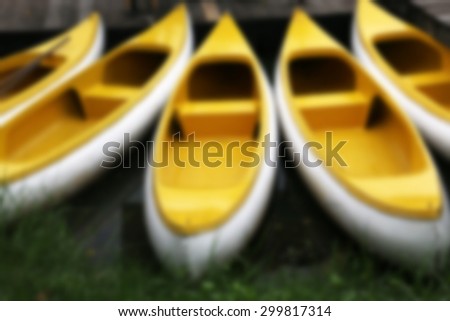Yellow boat on a river ,blurry background