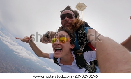 Similar – Image, Stock Photo paragliding man with orange paraglider against the sun