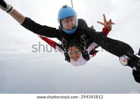 Skydiving tandem jump peace and love sign