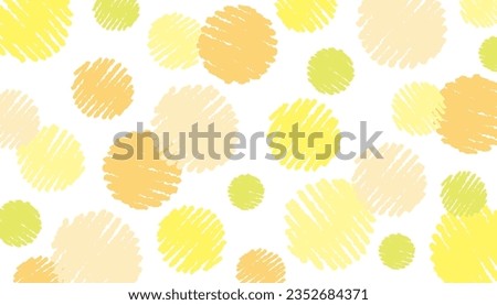 Cute yellow, yellow-green and orange polka-dot background with hand-drawn crayon touch.