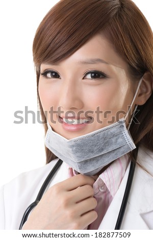 Asian doctor woman take off the surgical mask and smile at you, closeup portrait.