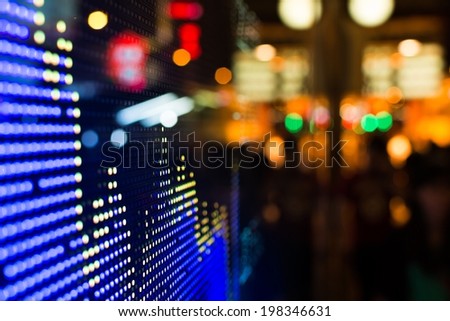 Hong Kong stock market price display at street in the night.