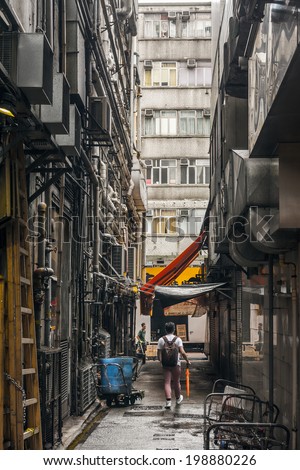 HONG KONG, CHINA - MAY 13 : City scenery of narrow lane in Hong Kong, China on 13th May 2014. The lane between buildings is very small.