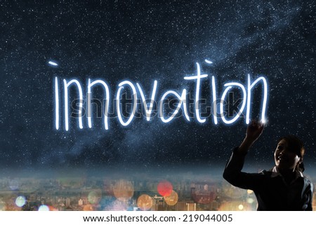 Concept of innovation, silhouette asian business woman light drawing.