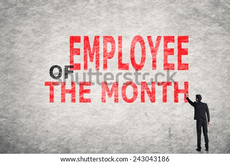 Asian businessman write text on wall, Employee of the Month