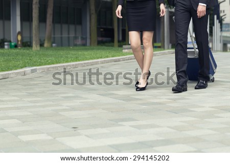 Business man and woman travel, closeup portrait and focus on the feet.