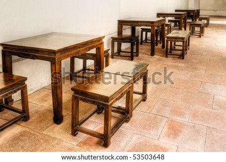 Chinese wooden chair and table in building.