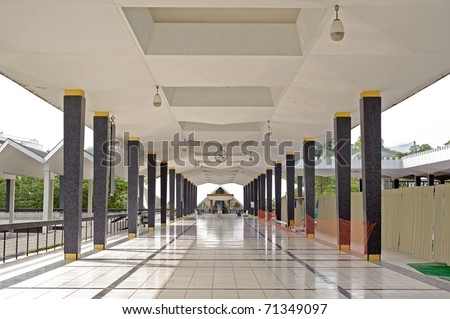 Mosque corridor covered with bright and white tiles in Kuala Lumpur, Malaysia, Asia.