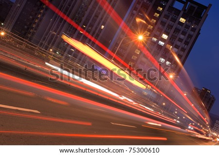 City night scene with car motion blurred in Taipei, Taiwan, Asia.