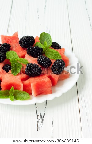 Refreshing watermelon salad with blackberries and mint. Fresh star shaped watermelon