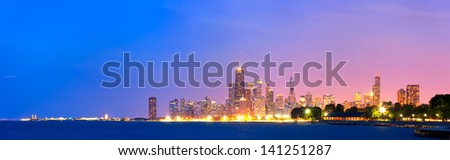 City of Chicago USA, sunset colorful panorama skyline of downtown with illuminated business buildings