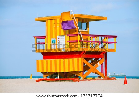 Miami Beach Florida, yellow Art deco lifeguard house on a beautiful summer day with ocean in the background