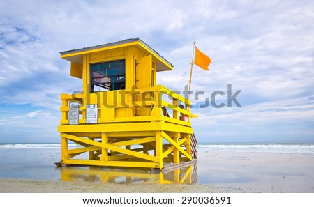 Florida beach yellow lifeguard house on a cloudy summer day  , Siesta Key