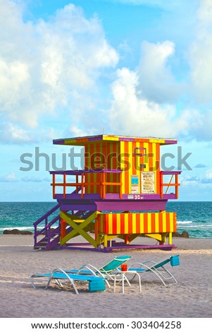 Miami Beach Florida, USA famous tropical travel location, typical Art Deco lifeguard house on a beautiful summer afternoon with ocean and blue sky