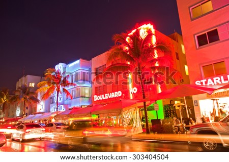 Miami Beach, Florida USA-April 5, 2013:Illuminated hotels and restaurants at sunset on Ocean Drive, world famous destination for nightlife, beautiful weather and pristine beaches