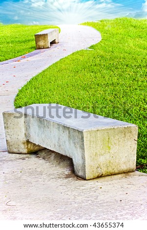 Concrete benches in the city park on a beautiful sunny day