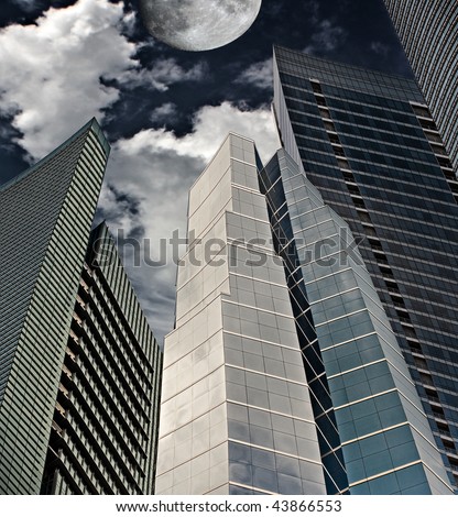 Dark business vision with tall financial buildings at night pointing to the moon