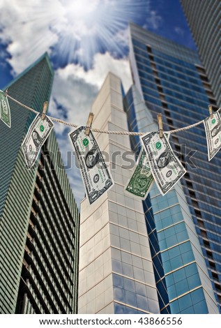 Financial and business metaphors with money hanging on a rope and banks and financial buildings pointing to the bright sky