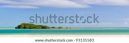 Landscape panorama of a Tropical island with mangrove trees, beautiful sky and clear ocean waters. Taken at Bahia Honda state park in the Florida Keys. Copyspace.