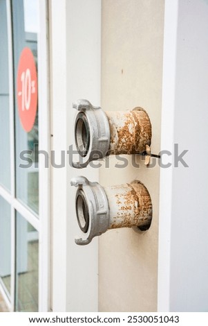 Similar – Image, Stock Photo two hydrants on old dirty wall of a house with closed blinds