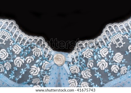 Lace decorated by pattern and decorative rose on black background