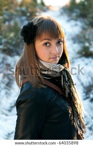 Portrait of the young beautiful girl in wood