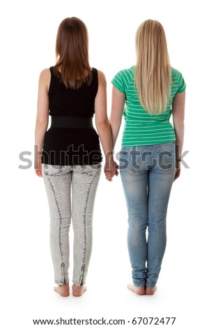 Two girls in jeans are back on a white background