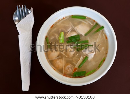 Thai soup dish with meat in brown cloth