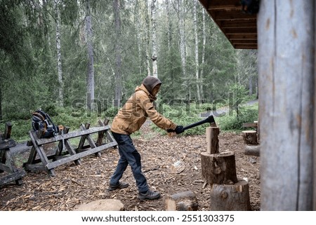 Similar – Foto Bild Mann mit Brennholz beim Lagerfeuermachen im Wald