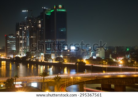 Cairo, Egypt - October 29, 2014: Traffic light trails in Cairo at night, the 15th May bridge, the Nile river and the Corniche Street.